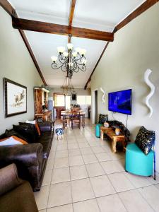 a living room with leather furniture and a ceiling at Seaview Villa 26 in Margate +16 photos