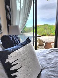 a bedroom with a bed and a window with a view at Seaview Villa 26 in Margate