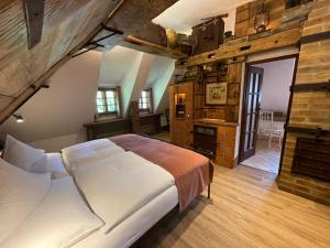 a bedroom with a large bed in a building at Romantik Hotel U Raka in Prague