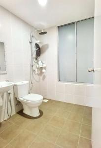 a bathroom with a toilet and a sink at Angel Homestay Bayu Andaman in Kuala Lumpur