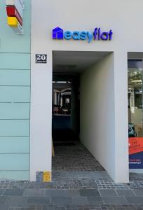 an entrance to an office building with the exit sign at easy flat Villach main plaza in Villach