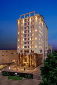 a large building with lights on top of it at Doubletree By Hilton Varanasi in Varanasi