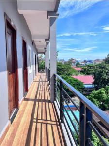 a balcony of a house with a view at Kro Nhep Guesthouse in Kampot