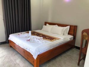 Postel nebo postele na pokoji v ubytování Kro Nhep Guesthouse