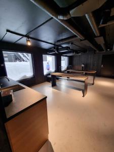 a large room with a ping pong table in it at Kikut Alpin Lodge - Ski in, Ski out in Geilo