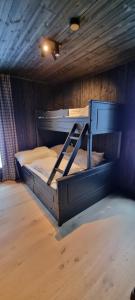 a bedroom with two bunk beds in a room at Kikut Alpin Lodge - Ski in, Ski out in Geilo