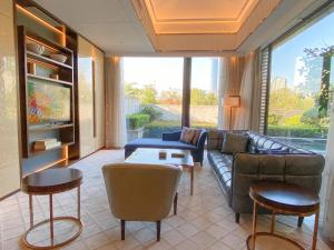 a living room with a couch and a table at Le Méridien Suzhou, Suzhou Bay in Suzhou