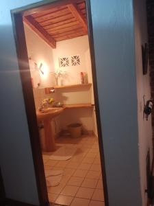 a bathroom with a sink and a toilet in a room at Dik Dik Hotel in Arusha