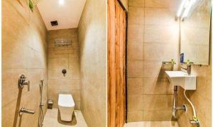 a bathroom with a toilet and a sink at FabHotel Ascot International II in Mumbai