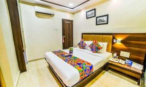 Postel nebo postele na pokoji v ubytování FabHotel Ascot International II - Nr Mumbai International Airport
