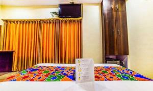Postel nebo postele na pokoji v ubytování FabHotel Ascot International II - Nr Mumbai International Airport