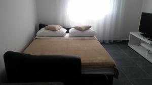 Ein Bett oder Betten in einem Zimmer der Unterkunft Apartments Diamond