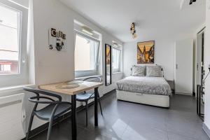 Ένα ή περισσότερα κρεβάτια σε δωμάτιο στο Résidence le premium, hyper centre, studio tout équipé