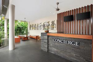 a lobby with a sign that reads conference at Amadea Resort & Villas Seminyak Bali in Seminyak