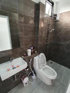 a bathroom with a toilet and a sink at duplex 2 bedroom sea view villa with private pool in Koh Samui +5 photos