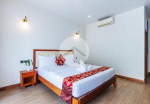 Postel nebo postele na pokoji v ubytování Zita Angkor Hotel