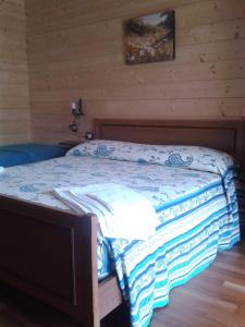 A bed or beds in a room at Colle Bianco