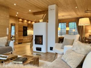 a living room with a couch and a fireplace at VILLA TUNDRA in Ruka