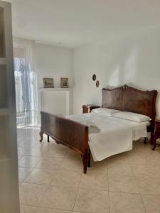 a bedroom with a large bed in a room at La casa di Nonna Celeste in Brindisi