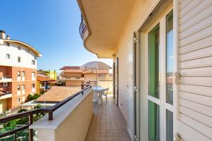 a balcony with a view of a building at Appartamento Minerva int6 - MyHo Casa in Tortoreto Lido