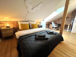 a bedroom with a large bed in a loft at Cozy Apartment near city center Dresden by R&L in Dresden