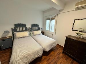Posteľ alebo postele v izbe v ubytovaní Mar de Beluso