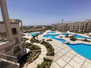 an aerial view of a resort with several pools at SUNNY BEACH resort apartment for rent in Montazah in Sharm El Sheikh
