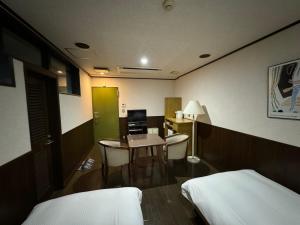 Postel nebo postele na pokoji v ubytování ホテルカスカベ Hotel Kasukabe
