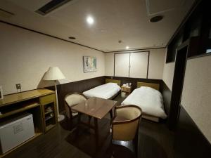 Postel nebo postele na pokoji v ubytování ホテルカスカベ Hotel Kasukabe