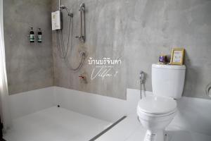a bathroom with a white toilet and a shower at V1-Baan Borijinda-Wooden House in The old city of Chiang Mai in Chiang Mai +39 photos