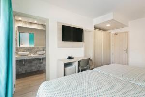 Posteľ alebo postele v izbe v ubytovaní Hotel Best Lloret Splash