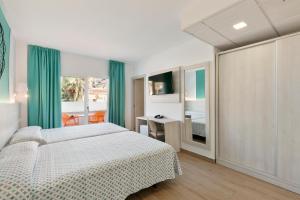 Posteľ alebo postele v izbe v ubytovaní Hotel Best Lloret Splash