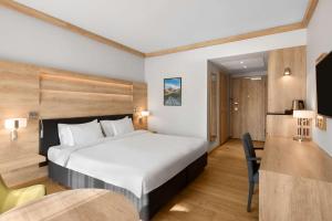 Postel nebo postele na pokoji v ubytování Radisson Blu Hotel & Residences