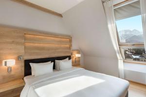 Postel nebo postele na pokoji v ubytování Radisson Blu Hotel & Residences
