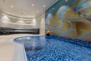 Bazén v ubytování Radisson Blu Hotel & Residences nebo v jeho okolí