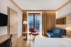 Postel nebo postele na pokoji v ubytování Radisson Blu Hotel & Residences