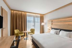 Postel nebo postele na pokoji v ubytování Radisson Blu Hotel & Residences