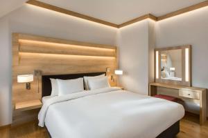 Postel nebo postele na pokoji v ubytování Radisson Blu Hotel & Residences