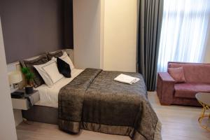 A bed or beds in a room at Star of İstanbul Residence