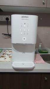 a white blender sitting on top of a counter at Sensorizza @ Sensory Residence in Kampong Tangkas