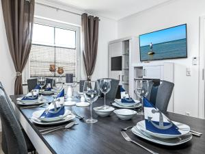 Μια τηλεόραση ή/και κέντρο ψυχαγωγίας στο Ferienanlage Pfeiffer Haus Strandrose