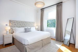 Ένα ή περισσότερα κρεβάτια σε δωμάτιο στο Veeve - Enchanting Light