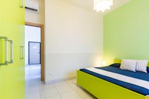 a bedroom with a bed and a hallway at Appartamento Minerva int2 - MyHo Casa in Tortoreto Lido