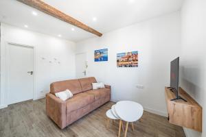 a living room with a couch and a table at Joli 2 pièces - Coeur de Ville - AW in Antibes