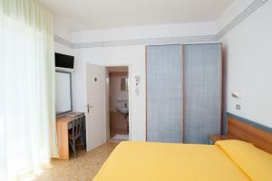 Postel nebo postele na pokoji v ubytování Albergo Villa Mauri