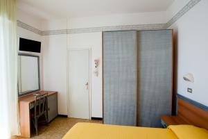 Postel nebo postele na pokoji v ubytování Albergo Villa Mauri