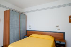 Postel nebo postele na pokoji v ubytování Albergo Villa Mauri