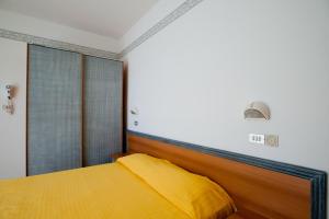 Postel nebo postele na pokoji v ubytování Albergo Villa Mauri