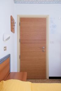 Postel nebo postele na pokoji v ubytování Albergo Villa Mauri
