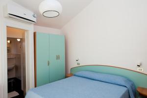 Postel nebo postele na pokoji v ubytování Albergo Villa Mauri